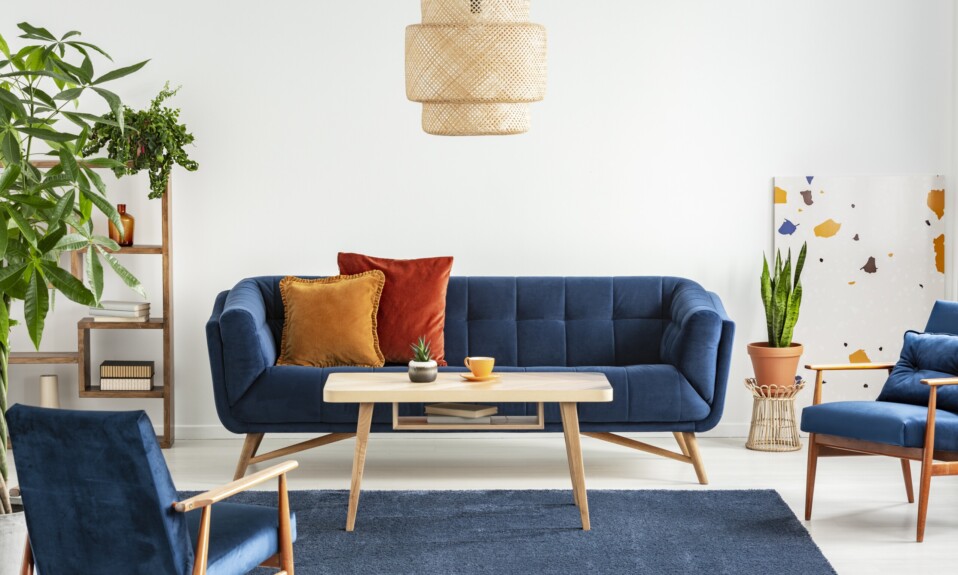 Blue wooden armchairs and couch in living room