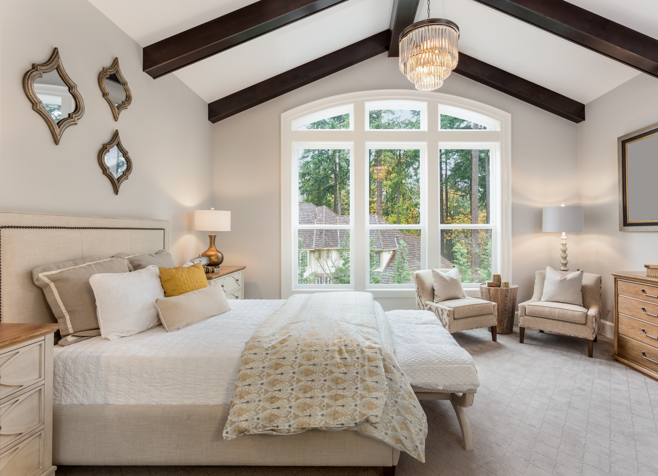 bedroom with wooden beams vaulted ceiling