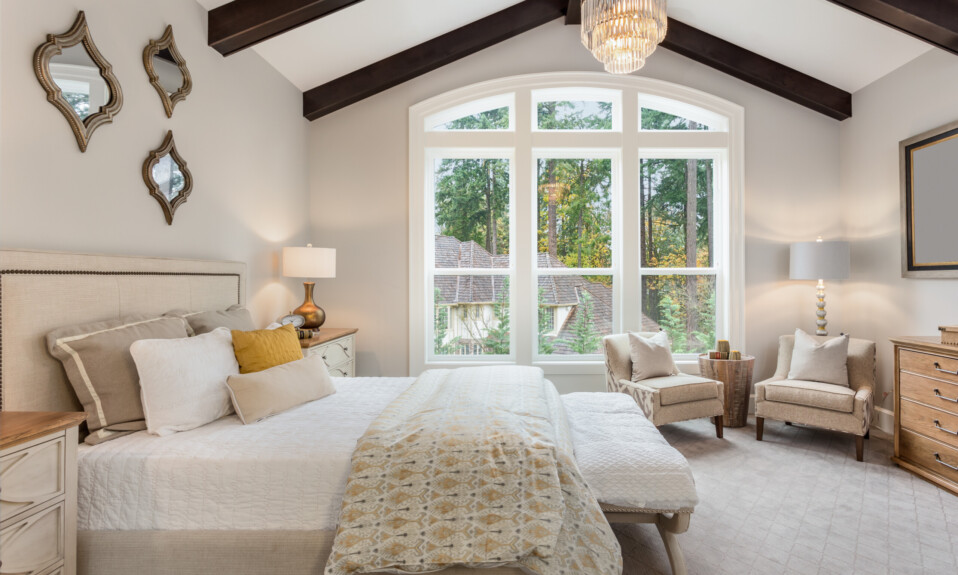 bedroom with wooden beams vaulted ceiling