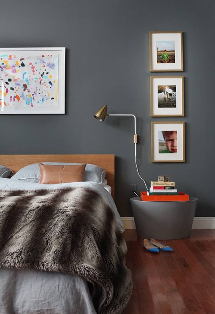 dark grey bedroom with art wall
