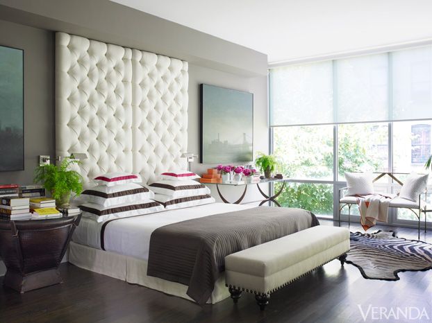 grey bedroom with white tufted headboard