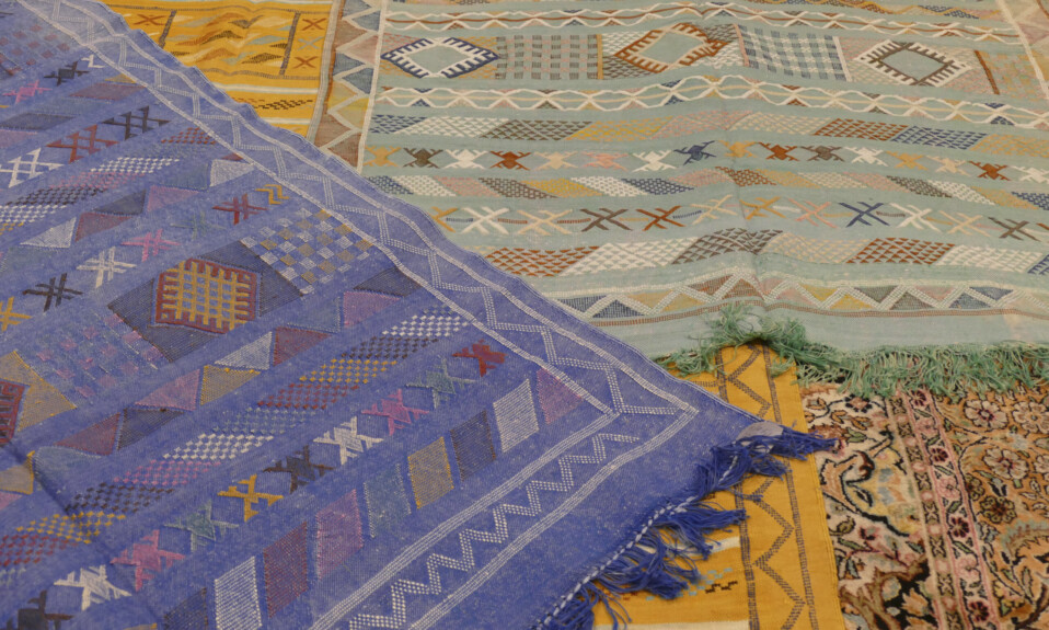 layering colorful rugs carpets