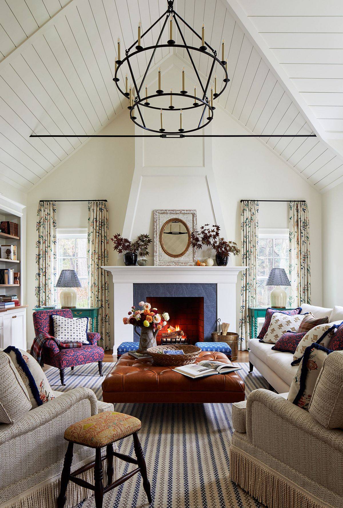 Modern farmhouse living room with angled high ceiling 