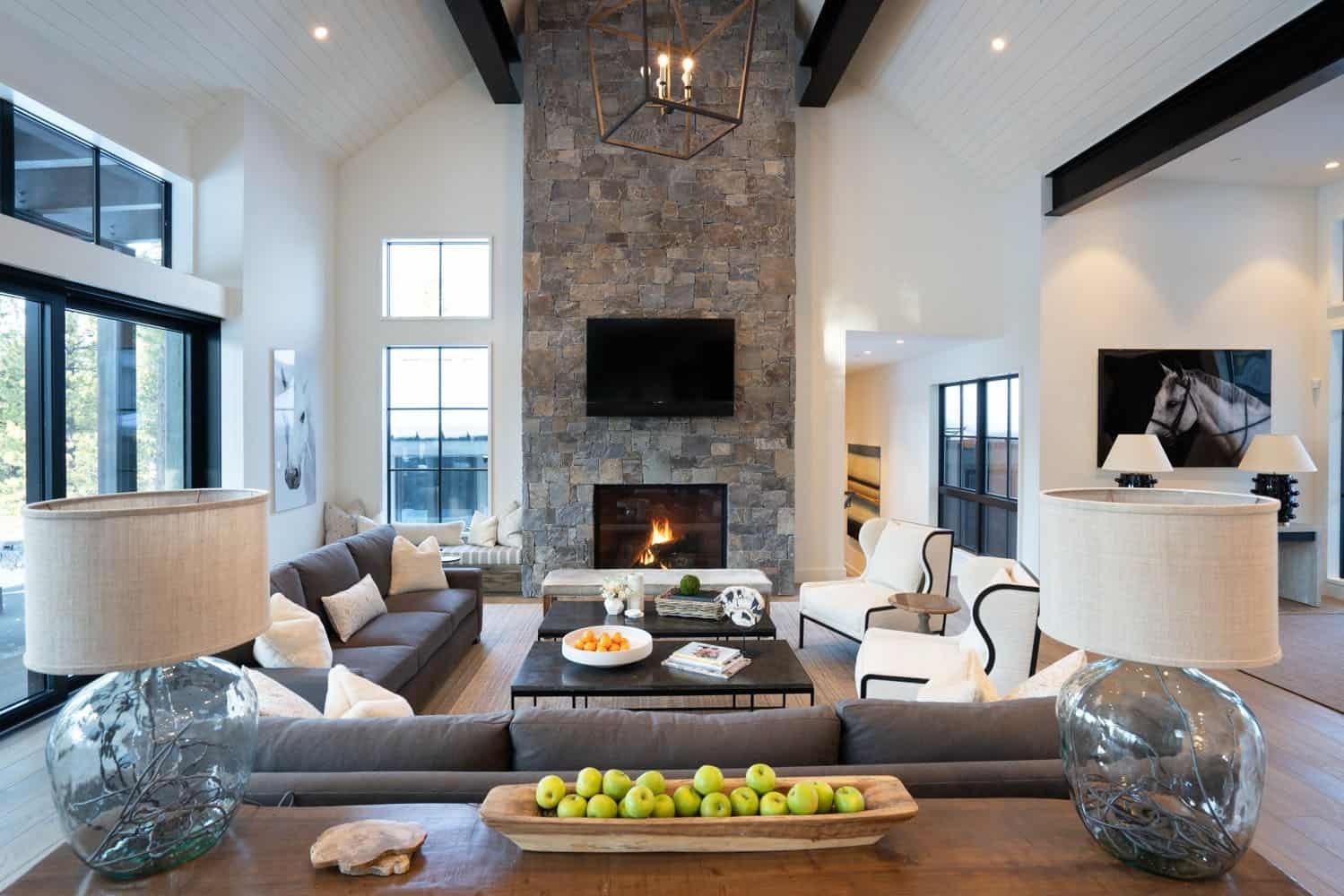 Modern farmhouse living room with grand stone fireplace 