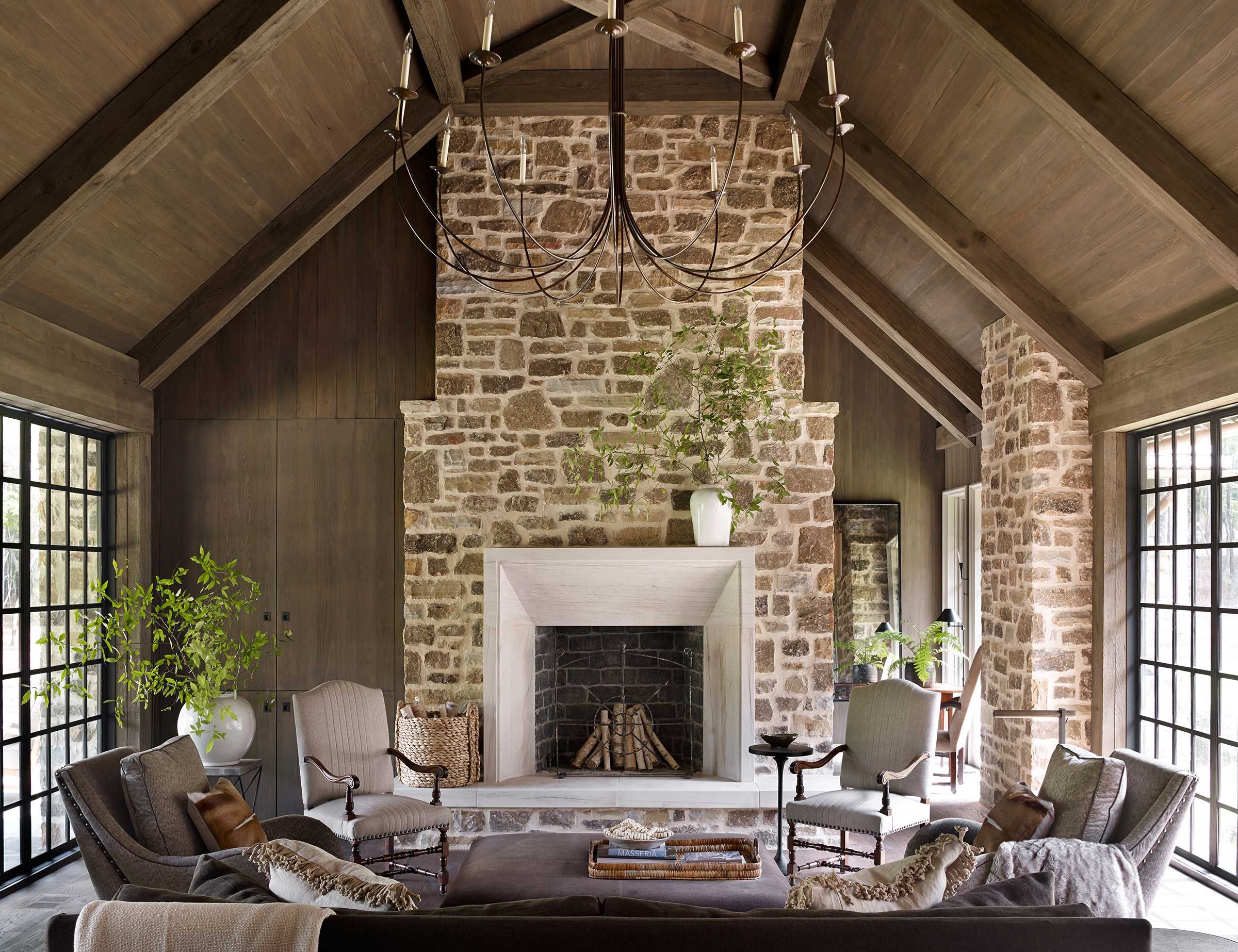 Modern farmhouse living room with grand stone fireplace 