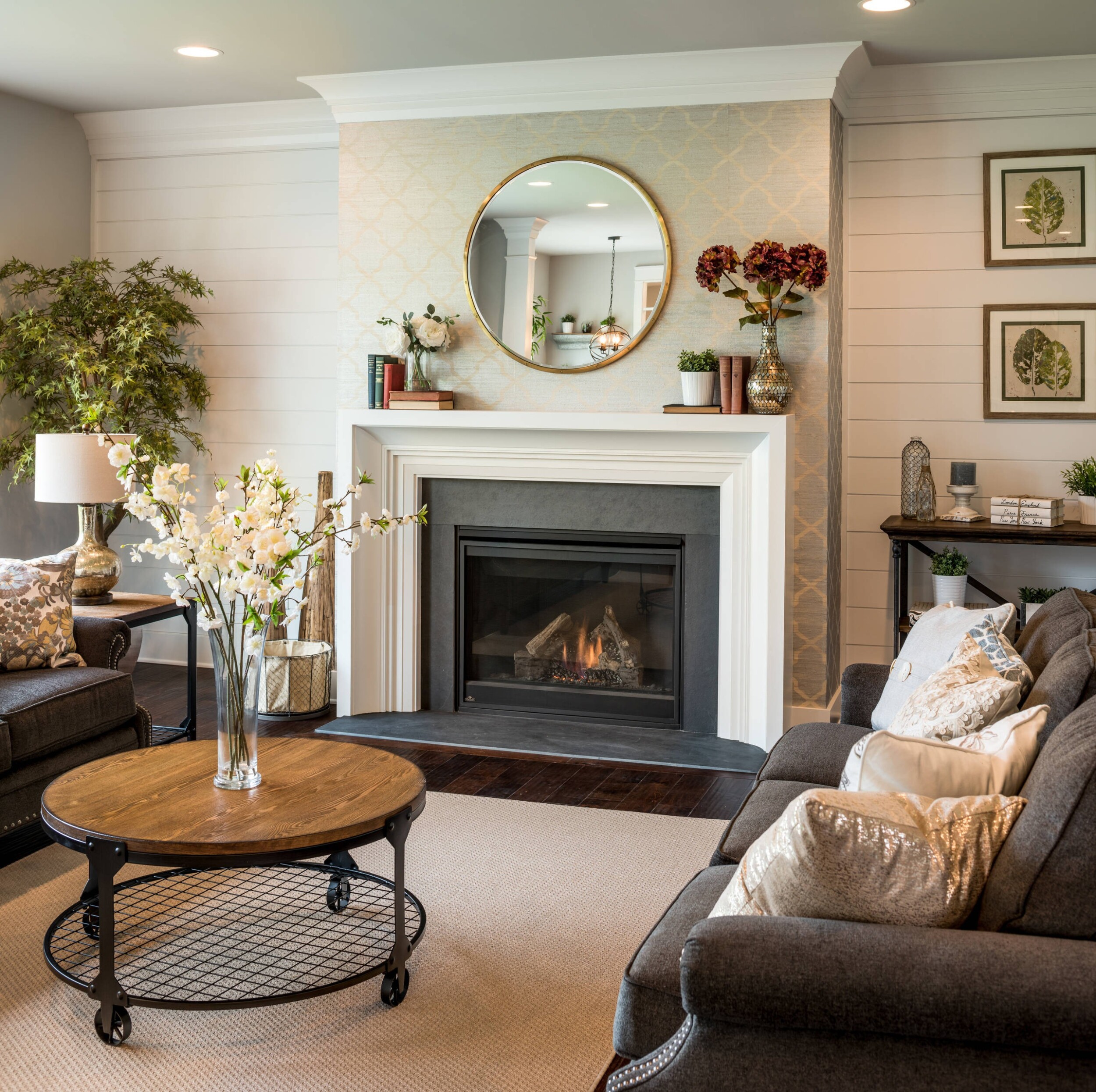 Modern farmhouse living room with wallpapered fireplace 