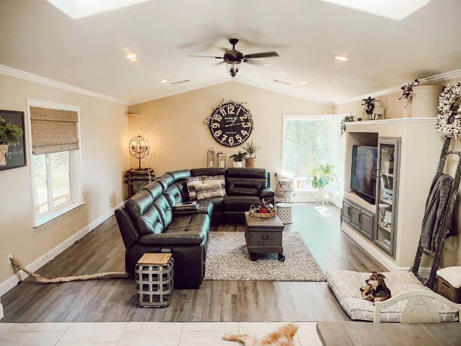 Modern living room with black leather sectional 