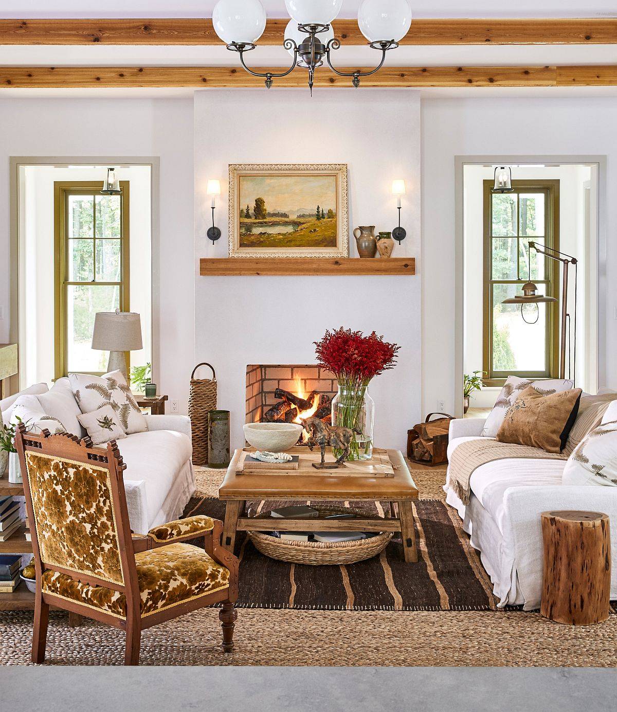 Modern living room with fireplace and wood beams on ceiling 